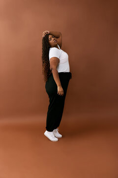 Full-Body Pose Against Brown Background