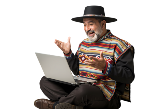 Hispanic man shares good news on laptop, overjoyed