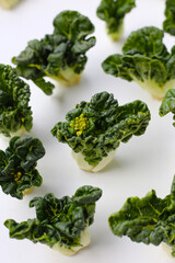 Fresh baby bok choy with crisp white green leaves.