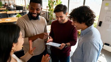 modern coworking office with diverse team discussing project around digital tablet, bright daylight, cinematic handheld - Powered by Adobe