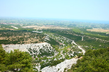 Vast coastal plain and patchwork fields fading into hazy horizon, July, 2008