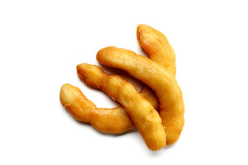 Sweet preserved tamarinds on white background.