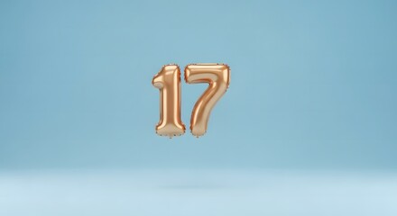 Dynamic 3D artwork showing the number seventeen as a reflective gold foil balloon, set against a smooth, bright blue background, perfect for age and milestone events