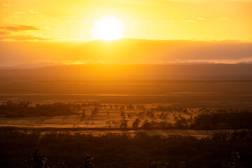 The vast Kushiro Wetlands shine golden in the light of the setting sun