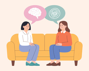 Mental Health Therapy Session with Two Women on a Couch Discussing Feelings
