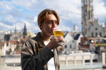 Enjoying a Refreshing Beer With a Stunning City Backdrop