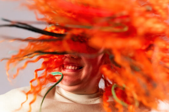 Happy woman showing new hairstyle