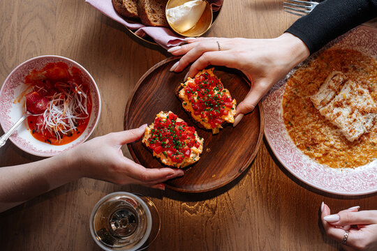 Shared brunch with bruschetta, risotto, and salad