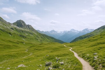 Obraz premium Lush Green Mountain Valley with Hiking Trail on a Sunny Day in the Alps