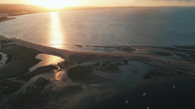 rone Footage of Tropical Queensland&rsquo;s Town of 1770 at Sunset &mdash; Golden Coastal Light, Coral Sea Views, and Gateway to the Great Barrier Reef&rsquo;s Pristine Marine Landscape