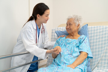 Fototapeta premium Asian doctor checking and treat elderly woman patient health in hospital.