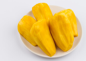 Ripe Jackfruit Segments on White Plate. Close-up of Golden Yellow Jackfruit Flesh