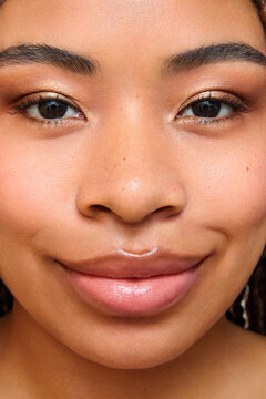 Woman with radiant skin and soft makeup.