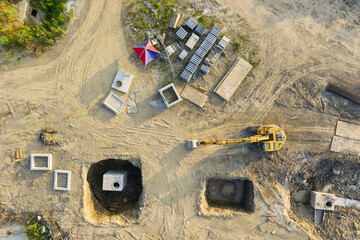 Aerial View of Construction Site and Excavator