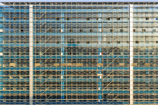 New Building with Scaffolding and Blue Glass Facade
