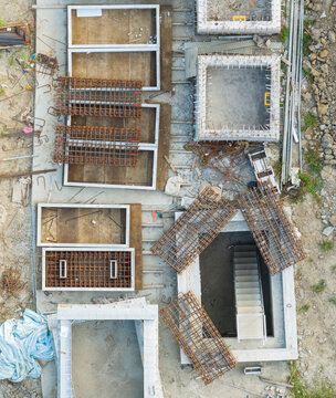 Aerial Construction Site with Rebar and Concrete Foundations