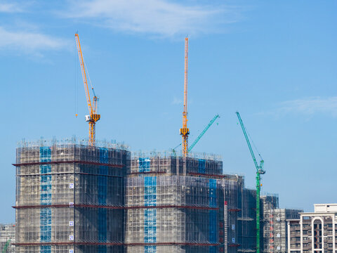 Construction Site with Cranes and Buildings Under Construction