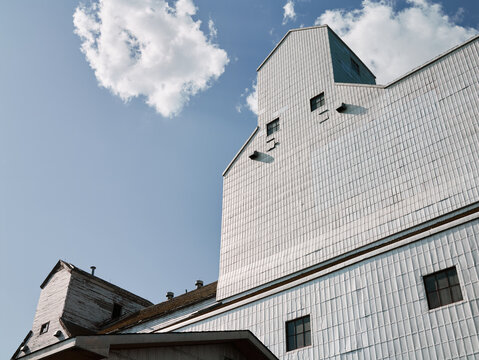 Grain elevator with industrial yellow chute