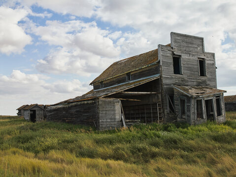 Abandoned wooden house in ghost town prairie