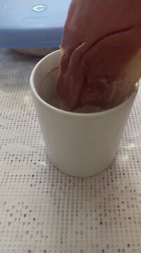 opening a jar of honey to sweeten coffee