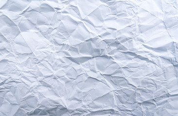 Wrinkled white paper surface under natural light, showing real folds and texture. Ideal for background, design, or minimal creative projects.
