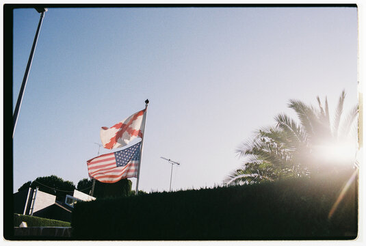 US and Cross of Burgundy Flags Waving