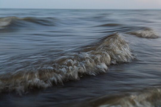 Waves Motion Texture Gently Crashing in Tranquil Dusk