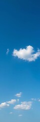 Obraz premium Deep cerulean expanse with a few scattered white clouds, creating a sense of calm, peaceful, cerulean