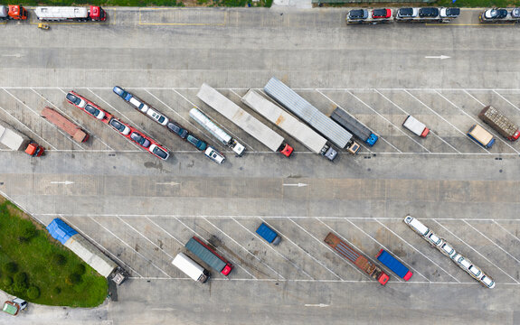 Aerial view of trucks and trailers parked in highway service area