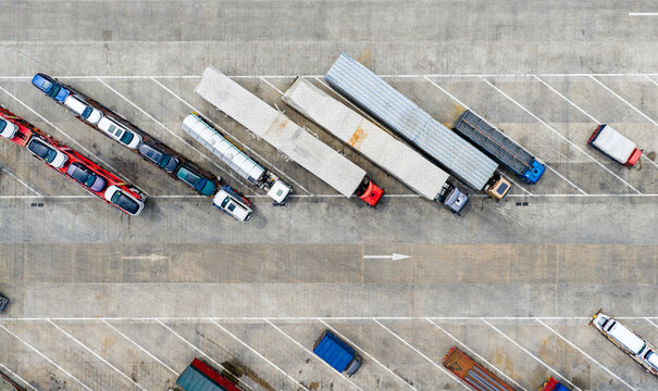 Aerial view of trucks and trailers parked in highway service area