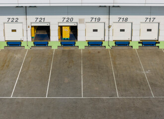 Warehouse Loading Dock with Open Bays and Cargo Pallets