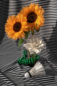 Abstract Still life with Sunflowers, White Flower and Shuttlecock. 