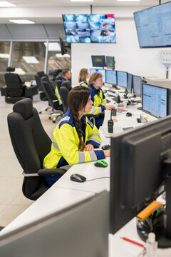 Control Room Staff Monitor Activity at Industrial Site