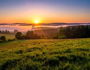 Obraz premium Sunrise over a grassy valley