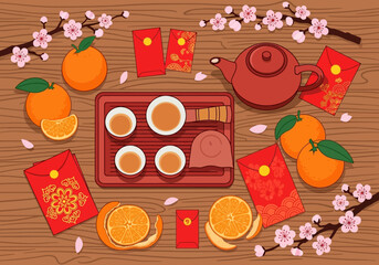 Chinese New Year Festive Table Setting with Oranges and Tea.