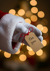 Extreme close-up of Santa Claus’s white glove 