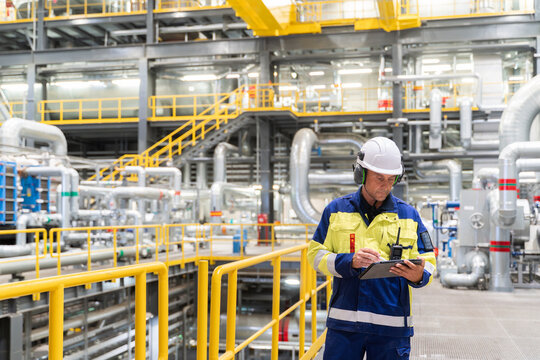 Technician Conducting Inspection in Power Plant