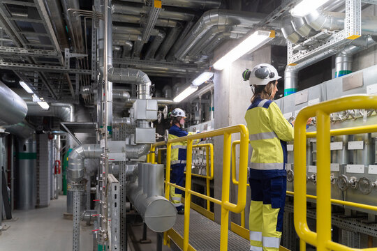 Engineer Working on Control Panel in Energy Plant
