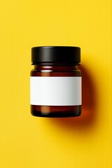 Brown cosmetic cream in a glass jar with a cap, isolated on white