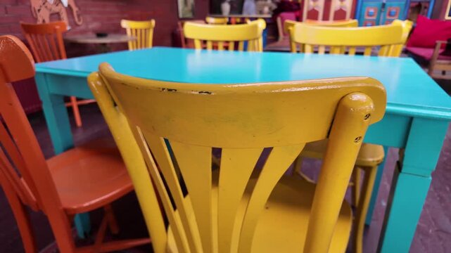 Brightly colored chairs at a cozy cafe interior