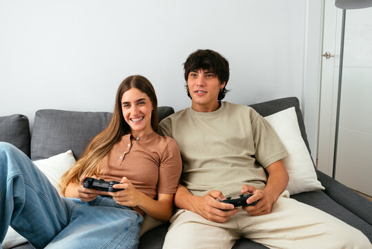Happy Couple Playing Video Games Together at Home