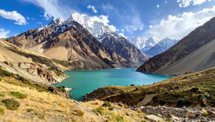 Naklejka premium Breathtaking Turquoise Lake Surrounded by Majestic Mountains in Hunza Valley.