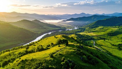 Lush Green Mountain Valley River Sunrise With Golden Light Illuminating Rolling Hills And Misty Fog In The Distance