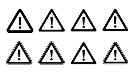 A series of black and yellow triangular warning signs with exclamation points