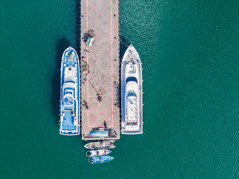 Aerial Marina View with Boats Docked at Concrete Pier