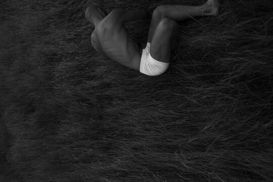 Emotional Unusual Pose Of Man In Natural Solitude Place