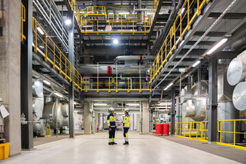 Workers Talking In Power Plant Workspace