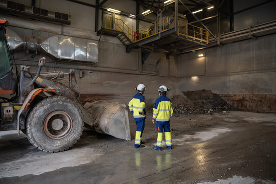 Workers at waste incineration site
