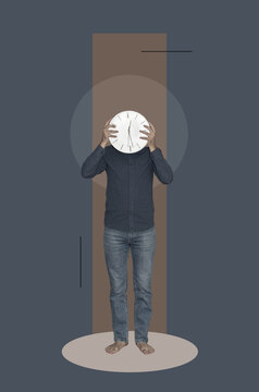 A man covering his face with a clock