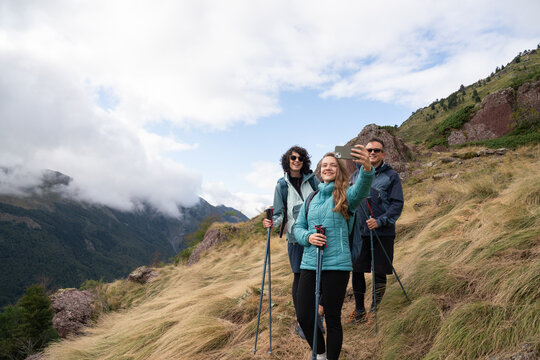 Friends Taking a Selfie While Hiking on a Mountain Trail